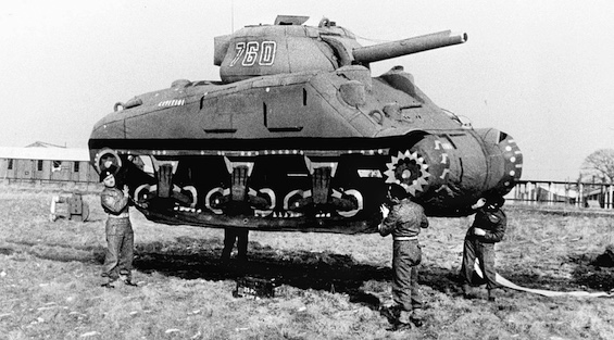 Photo of British soldiers holding inflatable tank, an action related to Operation Double Cross