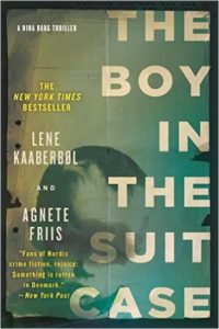 Cover image of "The Boy in the Suitcase," a novel that reveals something's rotten in denmark