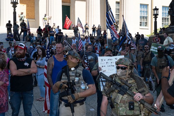 Photo of "militias" demonstrating in 2020, a factor in this novel about American refugees