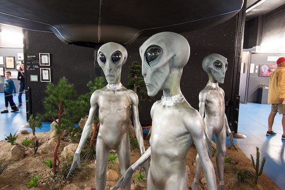 Museum representation of the "silver Tall Nordic" aliens that appear in this novel about where UFOs come from.