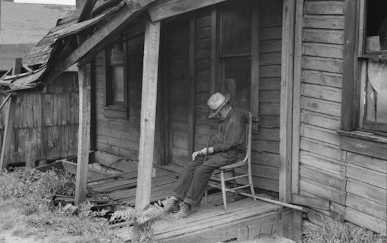Photo of man sleeping in a chair outside his home in eastern Pennsylvania, where this novel about Jews and African Americans together is set