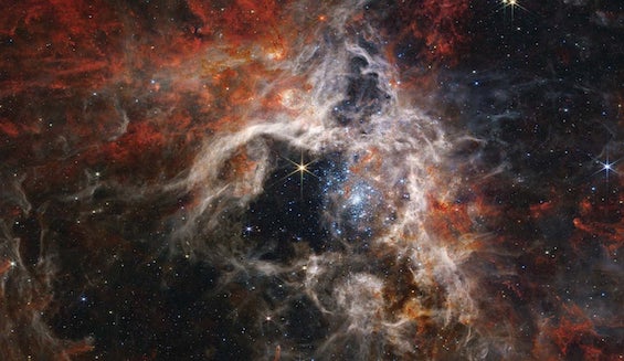 Photo of the Tarantula Nebula by the James Webb Space Telescope which suggests the sights viewed in this novel about a possible future among the stars