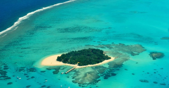 Aerial photo of an island in the South Pacific, like the one where this novel about a South Pacific adventure is set