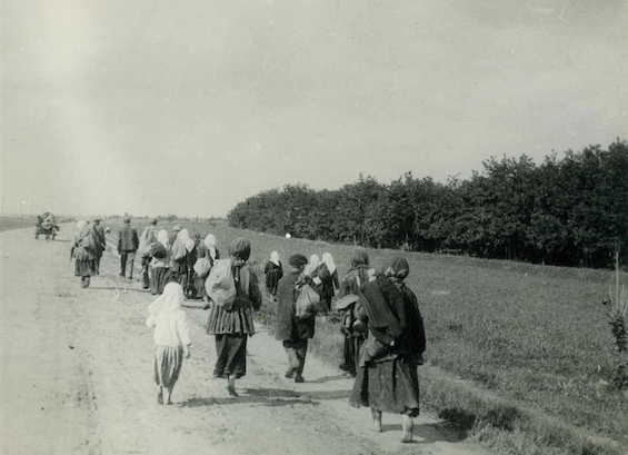 Photo of hungry Ukrainian peasants leaving home for food during the Holodomor, a pivotal event in this novel about the legacy of World War II