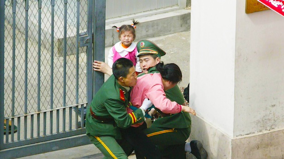 Photo of Chinese police capturing North Korean refugees