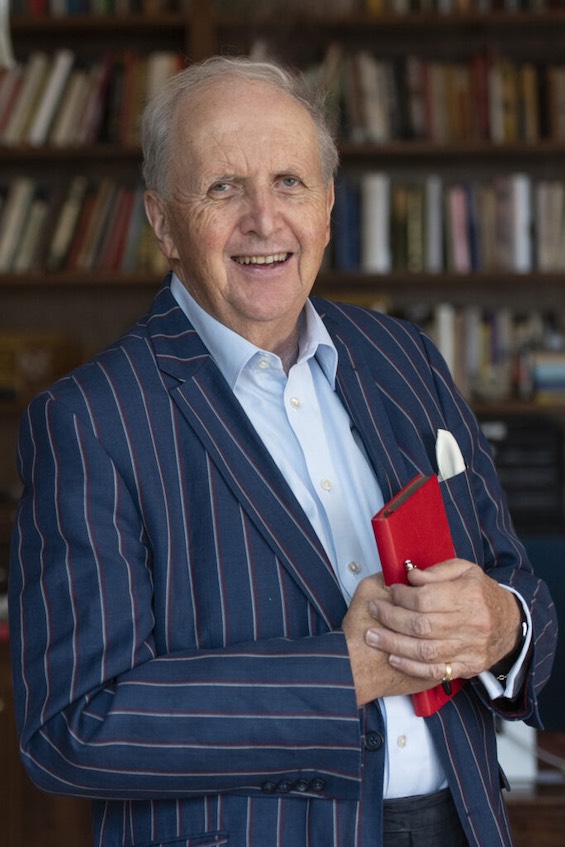 Photo of Alexander McCall Smith, author of these books pointing to Africa's future