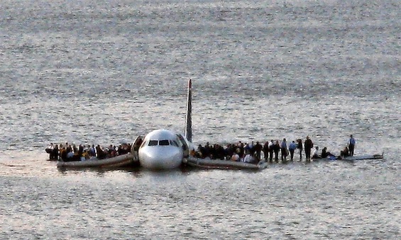 Photo of survivors on the wing of S Airways flight 1549 in 2009, an example of bird strikes on airplanes