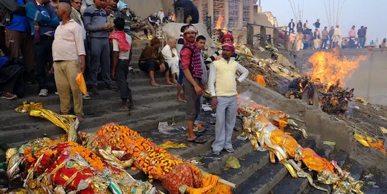 Photo of cremation ceremony along the Ganges in India, an important scene in this Wyndham and Banerjee mystery  