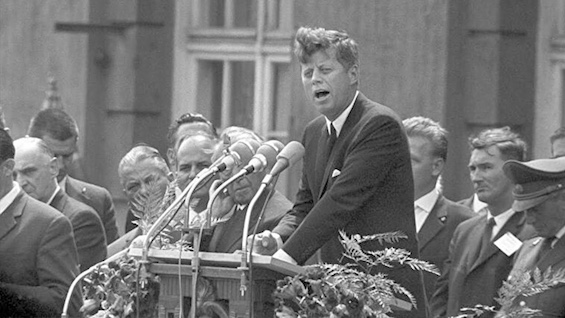 Photo of JFK speaking in Berlin, a major event in this novel about a travel-writer-turned-MI6-agent