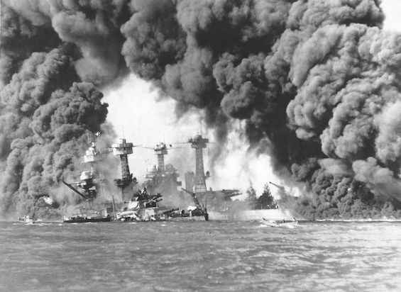 Photo of US battleship sinking at Pearl Harbor on December 7, 1941, an attack made possible by Nazi spies in Hawaii