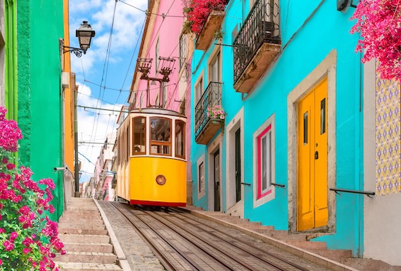 Photo of a tram descending a Lisbon street like the streets in this kidnapping thriller