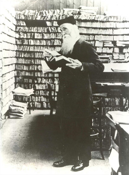 Photo of Dr. James Murray in the Scriptorium, with walls of pigeonholes in the background, where the world's most important dictionary was first created.