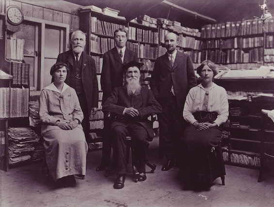Photo of the senior staff of the Oxford English Dictionary, who bear no resemblance to that of its competitor in this novel about a dictionary