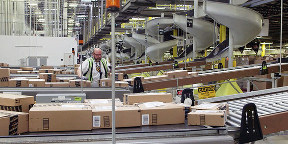 Image of an Amazon warehouse, one of the most visible elements in the Jeff Bezos story