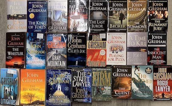 Photo of 24 of John Grisham's books, like this collection of stories about lawyers behaving badly